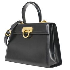 Brand Salvatore Ferragamo Style Hand Bag Color / Material Black/Leather Country Of Manufacture Italy Serial Number An 21 2101 Dimension Size ( Inch ) W 10.6 X H 7.9 X D 3.9 " (Approx.) Size ( Cm ) W 27 X H 20 X D 10 Cm (Approx.) Handle Drop ( Inch /Cm ) 4.3 "/ 11 Cm (Approx.) Shoulder Drop ( Inch /Cm ) 0 - 0 "/ 0 - 0 Cm(Approx.) Come With ( Accessories) - Pockets Outside - Inside Zipper Pocket*1 Example Of Ranks S New,Unused Sa Less Frequently Used Items A There Is A Little Feeling Of Used, Good Condition Ab There Is A Feeling Of Used, Some Noticeable Scratches And Dirt B There Is A Sense Of Overall Used, There Is A Dirt And Damages C There Is A Sense Salvatore Ferragamo Bags, Black Leather Handbag, Top Handle Handbags, Black Leather Handbags, Birkin Bag, Leather Handbag, Hand Bag, Gucci Jackie Bag, Dior Saddle Bag