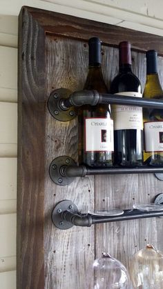 several bottles of wine are sitting on a shelf