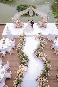 an overhead view of a wedding venue with flowers and chairs