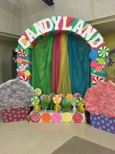 an entrance to candy land is decorated with candies and lollipops