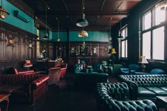 a room with many leather couches and chairs