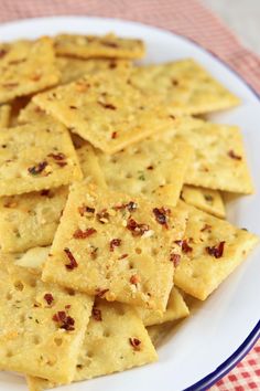 a white plate topped with crackers on top of a table