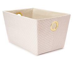 a pink storage box with gold handles on the inside and bottom, sitting on a white surface