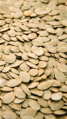 a pile of sunflower seeds sitting on top of each other