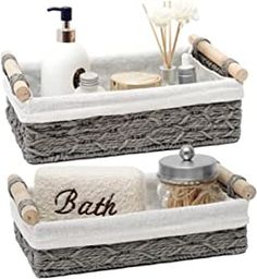 two baskets with towels, soaps and other items in them on a white background