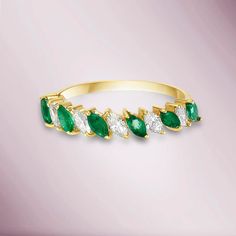 This Beautiful Halfway Marquise Emerald & Diamond Eternity Band Ring is a wonderful gift idea for occasions like wedding or anniversary featuring gleaming oval cut diamonds. This comes in white, yellow or rose gold. You can't go wrong with this simple and classic choice as a wedding band or anniversary ring, especi Marquise Brilliant Cut Emerald Ring, Marquise Emerald Ring With Brilliant Cut, Green Marquise Diamond Ring Fine Jewelry, Emerald Diamond Ring For May Birthstone In Marquise Shape, Marquise Emerald Diamond Ring In Green, Marquise Emerald Diamond Ring, Green Marquise Brilliant Cut Rings, Green Marquise Emerald Diamond Ring, Fine Jewelry Marquise Cut Emerald Ring With Diamond Accents