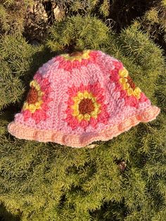 pink sunflower crochet granny square bucket hat, adult size small/ would fit best on smaller adult heads handmade in a smoke free and pet free house Pink Crochet Hat, Fun Style, Playful Pink Crochet Hat For Summer, Whimsical Handmade Bucket Hat For Spring, Handmade Pink Bohemian Bucket Hat, Handmade Whimsical Bucket Hat For Spring, Handmade Bohemian Pink Bucket Hat, Playful Pink Hand-knitted Crochet Hat, Fun Pink Yarn Hat, Playful Pink Crochet Hat For Spring