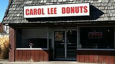 the store front of carol lee donuts