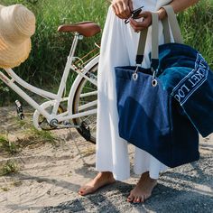 This beach-ready tote bag is made from quality terry cloth and is plastic-lined, making it ideal for carrying your bathing suit and towel. Its unique design and rich color add extra style and flair to your warm-weather look.