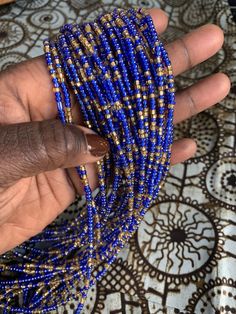 In Ghana we wear waist beads as a symbol of femininity. These playful beads can be wore over or under clothing. Traditionally they are worn on the "high hips" (think where your underwear sits) but can be worn where ever you feel the most beautiful! Wear a single strand or layer them! Each strand is sold individually even if pictured with others. Beads are safe to wear while bathing, sleeping, dancing and exercising. because they are on a cotton thread they will weaken and break over time. Add a Cheap Blue Waist Beads With Spacer Beads, Blue Colorful Waist Beads As Gift, Blue Beaded Waist Beads As Gift, Beach Waist Beads With Gold Beads, Gift Waist Beads With Small Beads, Gift Waist Beads With Tiny Beads, Gift Tiny Beads Waist Beads, Colorful Waist Beads For The Beach, Gold Beaded Waist Chain