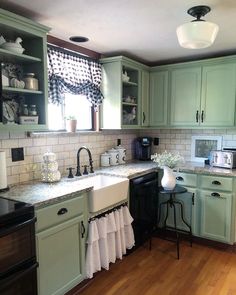 the kitchen is clean and ready for us to use it's dishes on the counter