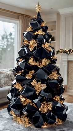 a black and gold christmas tree in a living room