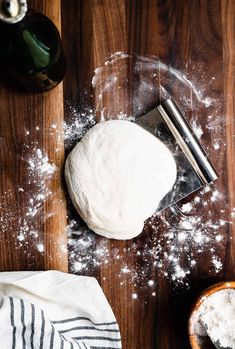 a wooden table topped with lots of flour