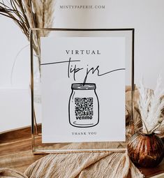 a glass frame with a jar on it next to some dried plants and a card that reads virtual tips thank you