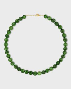 This elegant necklace features a polished chrome diopside sphere finished with a delicate 14k gold chain. Chrome diopside is a beautiful gemstone known for its vibrant green color. The smooth, polished sphere adds a touch of sophistication to the piece. This necklace is handcrafted in NYC and is a perfect everyday piece that adds a touch of natural beauty to any outfit. Chrome Diopside 14 Karat Gold 16 to 17.5 inches Handmade in NYC Chrome Diopside Jewelry, Formal Green Necklace With Gemstone Beads, Classic Green Gemstone Beads Necklace, Elegant Dark Green Round Beads Necklace, Elegant Dark Green Round Bead Necklaces, Elegant Dark Green Round Beaded Necklaces, Elegant Dark Green Beaded Necklaces, Sphere Necklace, Elegant Necklace