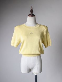 "butter yellow ribbed top. padded shoulders. features pointelle knit neckline and rhinestone applique in front. label: Cesey material: 65 acrylic 20 linen 15 nylon condition: excellent - one small mended hole at the back of the shoulder (last pic) size: fits XS-S shoulder 16\" bust 35\" waist 23\"-36\" sleeve 9.5\" length 21.5\" *PLEASE PROVIDE CONTACT NUMBER UPON CHECKOUT, THANK YOU!*" Angora Cardigan, Pointelle Knit, Butter Yellow, Classic Sweater, Rhinestone Appliques, How To Hem Pants, Yellow Top, Ribbed Top, Pleated Pants