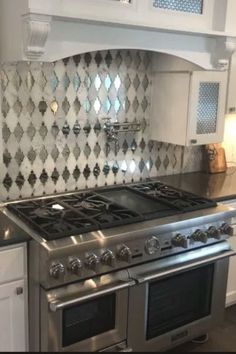 a stove top oven sitting inside of a kitchen