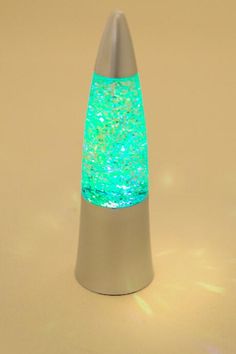 a blue and green light is on top of a metal cone with silver base,