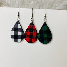 These buffalo plaid earrings are perfect if you love lightweight wood earrings.  These handcrafted earrings are laser cut from wood and paired with hypoallergenic, lead free and nickel free stainless steel earrings. These are lightweight earrings that are easy to wear all day without irritation. Tear drop earrings pair perfectly with any outfit or if you're looking for trendy jewelry. Whichever pair your choose or if you choose all three, they are earrings are eye catching and have a checkered pattern on both sides. I have these available in three options: red and black, green and black or white. Each pair measures  2.5" from top to bottom, 1" wide and 1/8" thick, which fall about half way from my earlobe to my neckline.  They are incredibly lightweight, so don't forget to take them out pr Plaid Earrings, Tear Drop Earrings, Steel Earrings, Blue Springs, Lightweight Earrings, Handcrafted Earrings, Wood Earrings, Light Weight Earrings, Stainless Steel Earrings