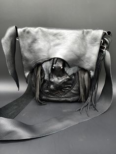 This double stitched pirate bag is made with premium cow hide leather. It has a large pocket on the back one inside and one hidden behind the tentacle deerskin for stash. It measures 10 inches wide and 11 inches deep. you can hook it to your belt or wear it cross body /shoulder. The strap will stretch so retie it to your desired length. ARRRRRRRRR Black Leather Gothic Bags, Gothic Leather Bag For Everyday Use, Black Gothic Leather Shoulder Bag, Gothic Leather Shoulder Bag For Travel, Gothic Leather Shoulder Bag For Daily Use, Gothic Leather Bags For Daily Use, Pirate Bag, Deer Skin, Hidden Pocket