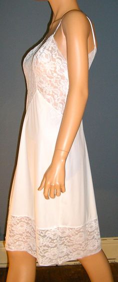 "Vintage 50s Vanity Fair white full lace slip. Antron nylon. Labeled size 34L. MINT condition, no flaws or damage. Measurements: Chest across front: 17\" Waist across front: 14\" Hips across front: 19\" Length from armpit: 33\" Please read all measurements and view all photos provided before purchasing as I do NOT accept returns. I do my best to list accurate measurements and notate all visible flaws/signs of wear. I am happy to send additional pictures of any listing. I usually ship the next bu Luxury Lace Bodice Slip Dress For Wedding, Slips For Women Nordstrom, Fitted Sheer Lace For Wedding Night, White Sleeveless Slip For Wedding Night, Fitted Delicate Lace Slip, Delicate Lace Fitted Slip, Fitted Lace Slip For Summer, Fitted Lace Slip With Delicate Details, Fitted Lace Slip With Delicate Lace