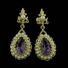 Amethyst Pearls Earrings Chandelier Dangle Earring Victorian Style Gold Gemstone Cultured Pear Victorian style amethyst (Approx. 8ct) and pearl drop earrings 14kt yellow gold with post backs and cultured pearls strung on a gold wire. Earrings are 40mm long (1.6inch), 16 mm wide (0.6 inch). This style is also available in white gold and a variety of other gems such as: Citrine, Amethyst, Garnet and Peridot. Please contact us if you are interested in any of these options. PROUDLY MADE FROM SCRATCH Luxury Amethyst Teardrop Earrings, Elegant Amethyst Earrings For Formal Occasions, Elegant Purple Earrings For Pierced Ears, Elegant Purple Pierced Earrings, Ornate Purple Drop Earrings, Purple Drop Chandelier Earrings For Formal Occasions, Elegant Amethyst Dangle Earrings, Ornate Purple Dangle Earrings, Elegant Purple Gemstone Chandelier Earrings