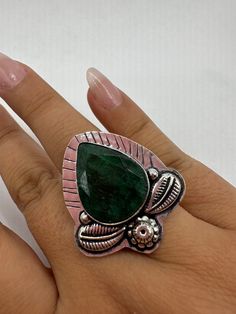 Vintage Green Raw Emerald Silver Bronze Statement Boho Ring Vintage Stone Lovely polished white bronze framed with same bronze work  Really cool statement ring  May be marked 925 But it is not.  Ring is over 1 inch We can re size these for a $20 jeweler's fee.  All rings are shipped in a nice gift box.   Check out our over a THOUSAND great reviews Engraving is $4 per letter and is not always perfect depending on the piece. It can take a few days if the jeweler is busy. This is payable to Paypal Artisan Hand Forged Green Rings, Snake Ring Gold, Raw Emerald, Vintage Rainbow, Snake Ring, Boho Ring, Raw Stone, Ring Vintage, Boho Rings