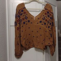 Gorgeous Free People Too, Goldish Mustard With Blue/ Purple Stitched Designs. V-Neck Front And Back. Brand New, One Size. Fitted Brown V-neck Blouse, V-neck Festival Tops For Fall, Beige V-neck Top For Festival, Brown Bohemian V-neck Top, Beige V-neck Tops For Festivals, Chic V-neck Blouse For Festival, Chic Brown Festival Tops, Chic Brown Tops For Festival, Off Shoulder Floral Top