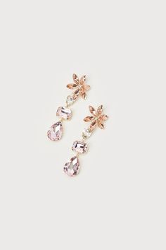 Celebrate all things sweet and sparkly with the Lulus Glittering Blooms Pink Multi Rhinestone Flower Drop Earrings! These darling earrings are composed of shiny, gold-toned metal that supports a variety of sparkling pink-toned rhinestones. Posts boast sweet floral arrangements of stones and support drop-style chains of multicolored rhinestones that finish with teardrop-shaped pendants. Post backs. 3. 75" Long And 1. 55" Wide. 50% Brass, 50% Glass. Imported. Lulus | Glittering Blooms Pink Multi R Gold Crystal Flower Shape Earrings For Parties, Glamorous Gold Flower Earrings, Glamorous Flower-shaped Party Earrings, Crystal Flower Earrings For Party, Gold Crystal Flower Earrings, Glamorous Flower Bridal Earrings For Party, Sparkling Flower Earrings For Party, Gold Crystal Flower Earrings For Party, Party Flower Drop Earrings With Sparkling Stones