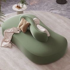 a green couch sitting on top of a white rug