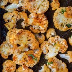 shrimp and cauliflower cooking in a skillet