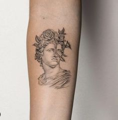 a woman's arm with a tattoo on it