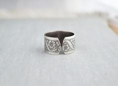 "Unique Butterfly Ring. Oxidized sterling silver plated. Ring band is 11mm wide. This ring is adjustable and fits a size 6-9 best. Visit my shop today to see other great items. :) http://www.etsy.com/shop/WearitoutJewelz ♥I LOVE custom orders. :) I will gladly make any matching earrings, hair pins, necklaces, rings, bracelets, etc. to your preference. Just contact me via conversations. I can also adjust chain lengths or switch out earring hooks, free of charge. Just leave me a note with your pre Adjustable Wide Band Engraved Ring For Gift, Adjustable Wide Band Ring Gift, Handmade Vintage Wide Band Open Ring, Vintage Handmade Wide Band Open Ring, Adjustable Silver Wide Band Ring As Gift, Adjustable Wide Band Open Ring For Gift, Adjustable Open Band Wide Ring For Gift, Vintage Sterling Silver Wide Band Ring Gift, Unique Butterfly