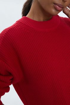 Mockneck long sleeve sweater with wide ribbed cuffs and collar. Crafted from a marled, waffle knit with directional knitting and dropped shoulders for a relaxed fit and transitional wearability. Ruby is a vibrant red colorway perfectly suited for statement styling. 100% Cotton Imported Textured Knit Funnel Neck Sweater For Work, Workwear Textured Knit Sweater With Funnel Neck, Modern Turtleneck Sweater With Ribbed Cuffs, Modern Ribbed Knit Sweater, Modern Winter Sweater With Ribbed Cuffs, Oversized Knit Cropped Sweater With Ribbed Collar, Oversized Knit Polo Sweater With Ribbed Cuffs, Funnel Neck Sweater With Ribbed Cuffs For Work, Modern Ribbed Collar Sweater For Fall