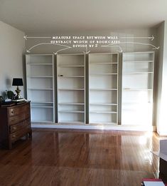 an empty room with white bookcases and wood flooring is shown in this image