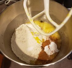 a mixing bowl filled with flour and other ingredients