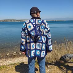 Unique special for man granny square blue hooded jacket can be gift for christmas. Birthday Gift, Valentines Day gift for your boyfriend. Perfect gift for Father Day choice for your Dad. 🎁Unique gift handmade gift. This Retro Crochet Cardigan can be a unique hand knitted gift for your husband.🎁 🧶I knitted with high quality cotton acrylic blend yarns.(55% Cotton, 45% Acrylic) This men or women hooded cardigan can be worn in any season. DIMENSIONS: The measurements of the cardigan worn by our m Patchwork Afghan, Man Cardigan, Hippie Men, Square Sweater, Crochet Waistcoat, Jacket Crochet, Sweater Colorful, Granny Square Cardigan, Afghan Coat