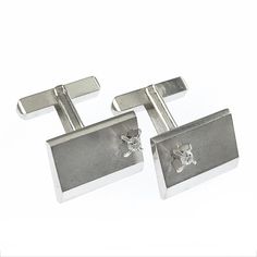 Platinum Diamond Cufflinks. A single 2.4 mm round diamond is set on one side of each of the cufflinks, the diamonds are VS (G.I.A.) in clarity and G-H (G.I.A.) in color. About three-quarters of the cufflink fronts are satin finish while the remainder is in a high polish finish. The cufflinks have a dual post and bullet backing. Engraved on the bullet backings in a script font is "J. Yano". Stamped on the back of the cufflinks is Pt900. The cufflink fronts measure approximately 17mm x 12mm. NOTE: Diamond Cufflinks, Bronze Hair, Diamond Cufflink, Mens Jewellery, A Script, Vintage Cufflinks, Bridal Hair Pins, Dark Gold, Script Font