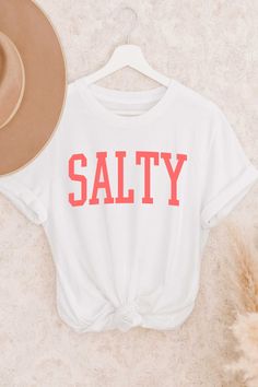 Make a statement in our Salty premium tee—nothing says it better (except maybe a few choice expletives). Crafted with 100% cotton, this classic fit unisex shirt will have you looking salty and feeling comfortable no matter where your day takes you. Trendy Everyday Shirt With Letter Print, Graphic Tee Shirt With Letter Print, Everyday White T-shirt With Letter Print, Everyday Tri-blend T-shirt With Letter Print, Graphic Tee With Text Print, White Print, Graphic Tee With Text Print In White, Graphic Tee With Text Print White Shirt, Relaxed Fit White Print Shirt With Letter Details, Relaxed Fit White Print Shirt With Text