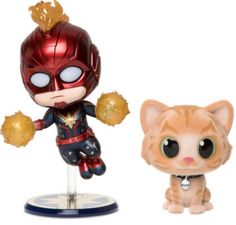 two small figurines are shown next to each other, one is cat and the other has an iron man figure