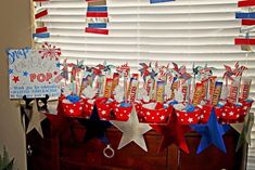 a table with red, white and blue stars on it in front of a window