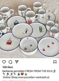 a table topped with lots of white plates and cups