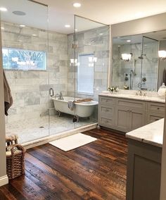 a bathroom with wood floors and marble walls