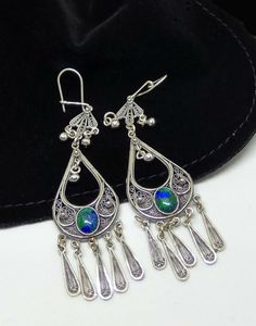 "Beautiful sterling silver dangle long earrings for women. We will inlaid the earrings with gems of your choice - Azurite, Garnet, Onix, or Amathist. ♥ Wrapped as a gift ABOUT THE ITEM ----------------------- ♥ DIMENSIONS - Length 3\" (8cm) with ear hoop.  ♥ Width 0.8\" (2cm).  ♥ weight 9 grams. ♥ Made from high-quality 925 Sterling silver. ♥ These earrings are made in a small workshop specializing in unique filigree design. ♥ For more earrings click here: https://www.etsy.com/il-en/shop/Gershiartofsilver?ref=seller-platform-mcnav%C2%A7ion_id&section_id=7763881 ♥ For gemstone jewelry click here - https://www.etsy.com/il-en/shop/Gershiartofsilver?ref=seller-platform-mcnav%C2%A7ion_id&section_id=19393379 PAYMENT & SHIPPING ------------------------------ ♥ Each design is made to order. All or Traditional Sterling Silver Teardrop Earrings, Festival Silver Teardrop Chandelier Earrings, Silver Teardrop Chandelier Earrings For Festivals, Silver Teardrop Chandelier Earrings With Latkans, Ornate Chandelier Dangle Earrings, Filigree Dangle Chandelier Earrings For Festivals, Festival Dangle Chandelier Earrings, Earrings Chandelier, Long Light