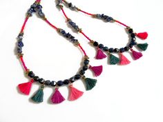 Dark bright shades of blue and pink, playful tassels and stars: this necklace is the perfect boho piece and a color accent to add to an outfit. Made with Lapis lazulli in geometric cut shapes, tiny handmade cotton tassels in pink, purple and petroleum green, raw brass stars and tubes and glass beads. ►Pick between different lengths, wear two necklaces for a statement layered look or a single strand as an accent. ►Length Options: 18/20/24/26/28 inches. Modeled necklaces are: Short necklace is 18 Bohemian Faceted Beads Necklaces For Summer, Adjustable Long Tassel Necklace With Dangling Beads, Adjustable Bohemian Tassel Necklace With Colorful Beads, Bohemian Necklace With Faceted Beads, Summer Bohemian Necklace With Faceted Beads, Adjustable Multicolor Beaded Tassel Necklace, Blue Bohemian Beaded Necklaces With Tassels, Bohemian Blue Beaded Necklaces With Tassels, Bohemian Tassel Necklace With Colorful Round Beads