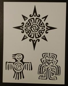 some black and white designs on a piece of paper with an eagle in the middle