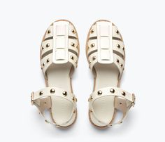 A tougher fisherman sandal. Made by hand in dove white calf leather, the SERA is classic with the caged upper and padded footbed but reimagined this season with cool gold studs. Channel a borrowed-from-the-boys look with tailored pants, or go feminine with a flowy dress. Dove White, Freda Salvador, Studded Leather, Tailored Pants, Handbag Shoes, Heeled Loafers, Rubber Heels, Leather Care, Gold Studs