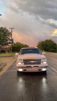 a white car parked on the side of a road