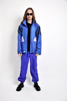 "90s retro nylon windbreaker jacket for men in blue colour by The Flagship. Size - XL (54). Model is 187 cm / 6ft 1.6\" tall and usually wears size M. Used but quite good vintage condition. All orders are shipped every day Worldwide from EU. Safe registered standard delivery Worldwide with courier and tracking number. You can also choose super fast 1-4 days DHL Express delivery. Just choose shipping upgrade in your cart.❗️Don't forget to write your phone number. It will be used only for delivery Retro Blue Windbreaker For Streetwear, Blue Retro Windbreaker For Streetwear, 90s Blue Windbreaker For Streetwear, 90s Style Hooded Blue Windbreaker, Retro Blue Nylon Windbreaker, 90s Style Blue Nylon Track Jacket, 90s Style Blue Track Jacket For Streetwear, 90s Style Blue Track Jacket For Outdoor, 90s Blue Track Jacket For Streetwear