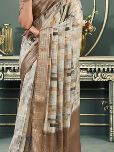 This exquisite saree is a perfect choice for all your upcoming festivals, events, and special occasions. Made from high-quality cotton fabric, this saree features a digital print work in an off-white and brown color combination, giving it a unique and elegant look.
The rich weaving pallu with a weaving border adds a touch of sophistication to the saree, making it a standout piece in your collection. The accompanying brown cotton blouse with zari weaving work perfectly complements the saree, comp Festival Off White Dupatta With Printed Motifs, Festive Digital Print Saree For Eid, Traditional Saree With Digital Print For Eid, Festive Anarkali Saree With Digital Print, Unstitched Digital Print Saree For Eid, Traditional Saree For Eid With Digital Print, Anarkali Saree With Digital Print For Wedding, Anarkali-style Wedding Saree With Digital Print, Digital Print Saree For Wedding And Eid